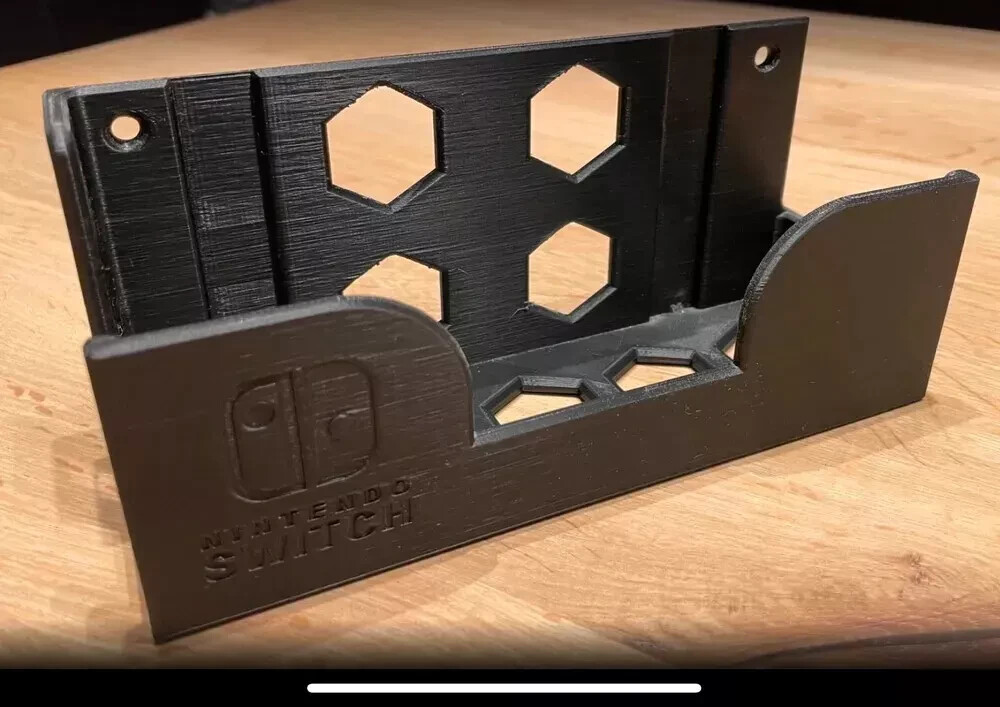 Nintendo Switch Wall Mount – Black or white, Nails not included.