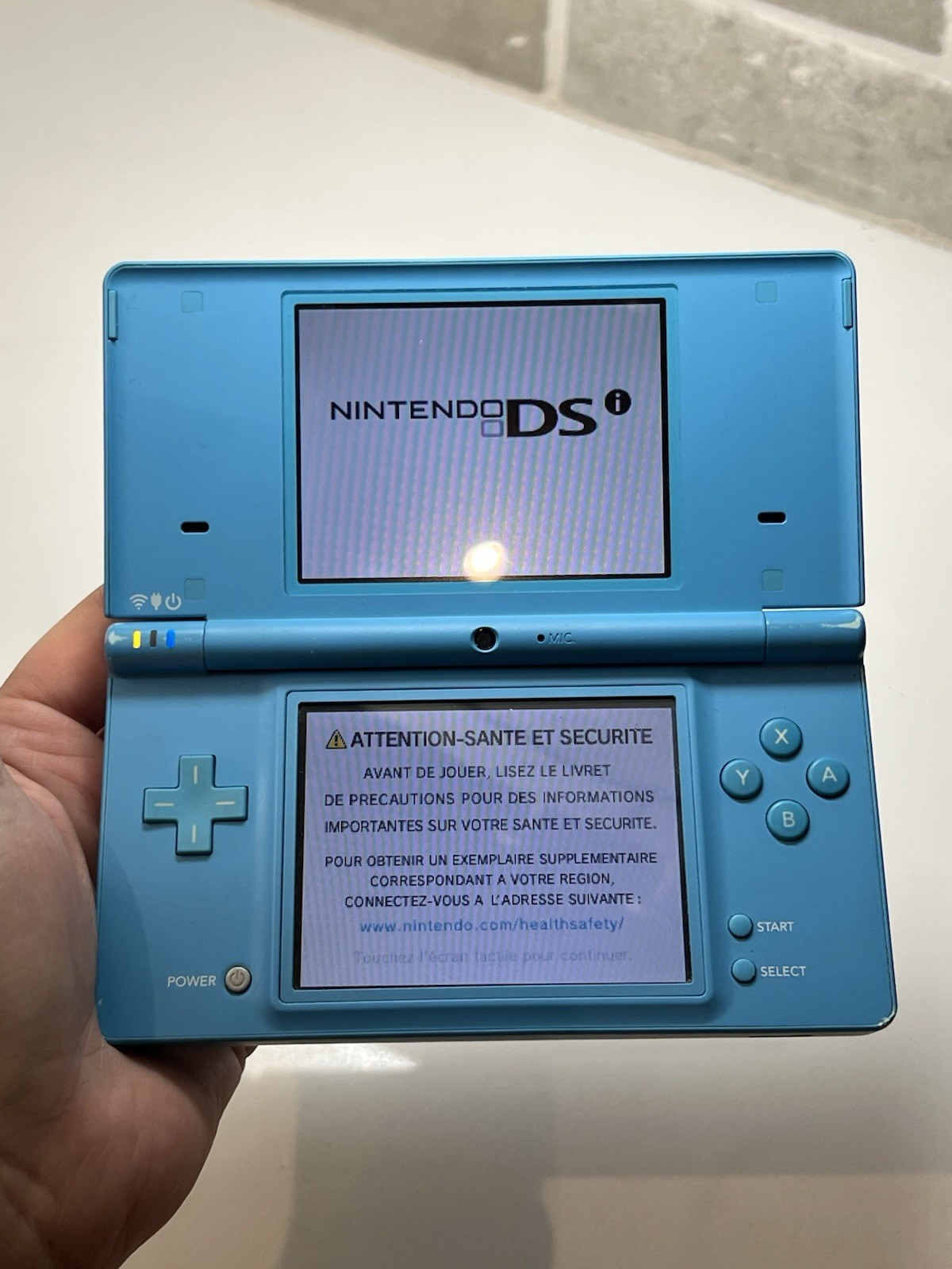Nintendo DSi Light Blue Handheld Console Game System + Charger + Stylus Tested
