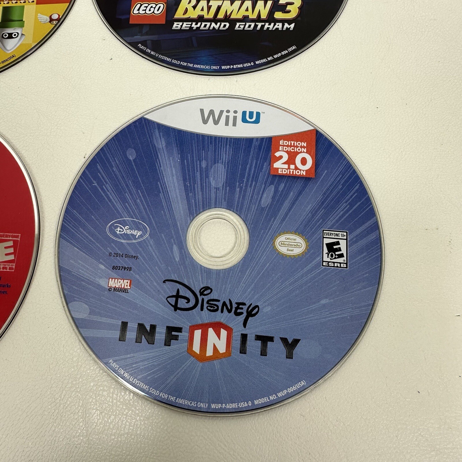 Wiiu Wii lot of 4 games Mario Maker Lego Batman Boom Blox Disney Infinity