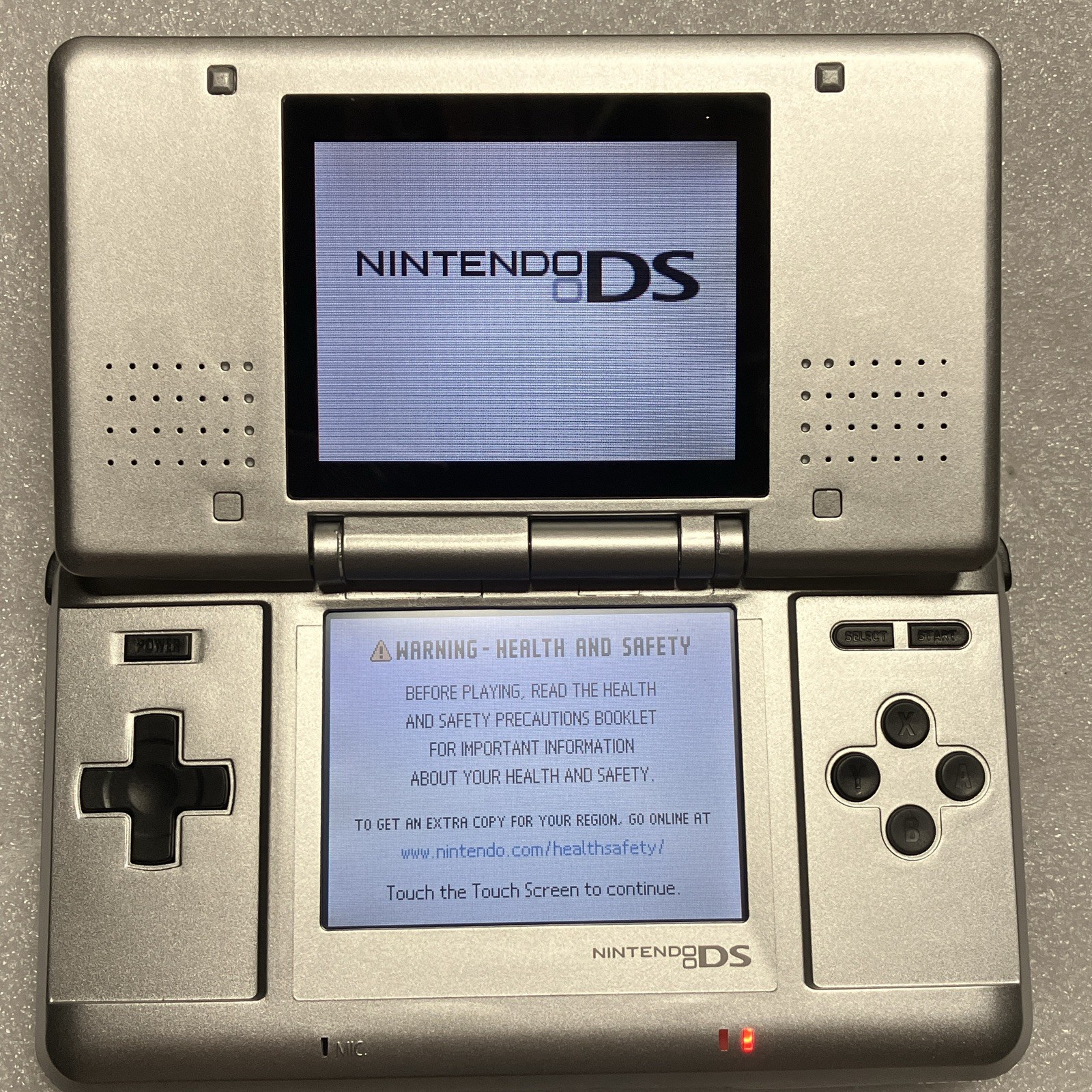 Nintendo DS Silver/Black Handheld Console as is no charger stylus or games