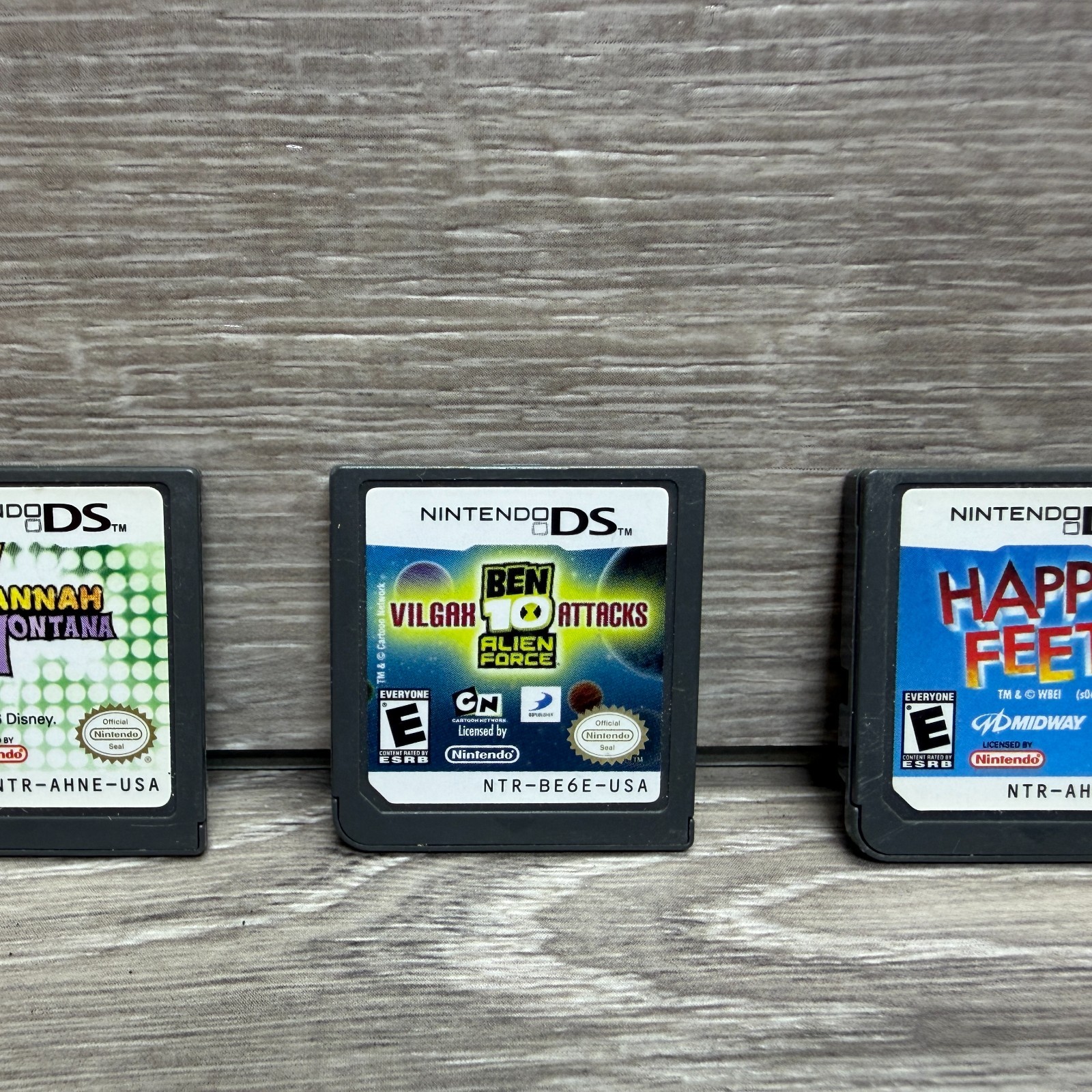 Nintendo DS Video Game Lot of 3 Kids Boys Girls Hannah Montana Ben 10 Happy Feet