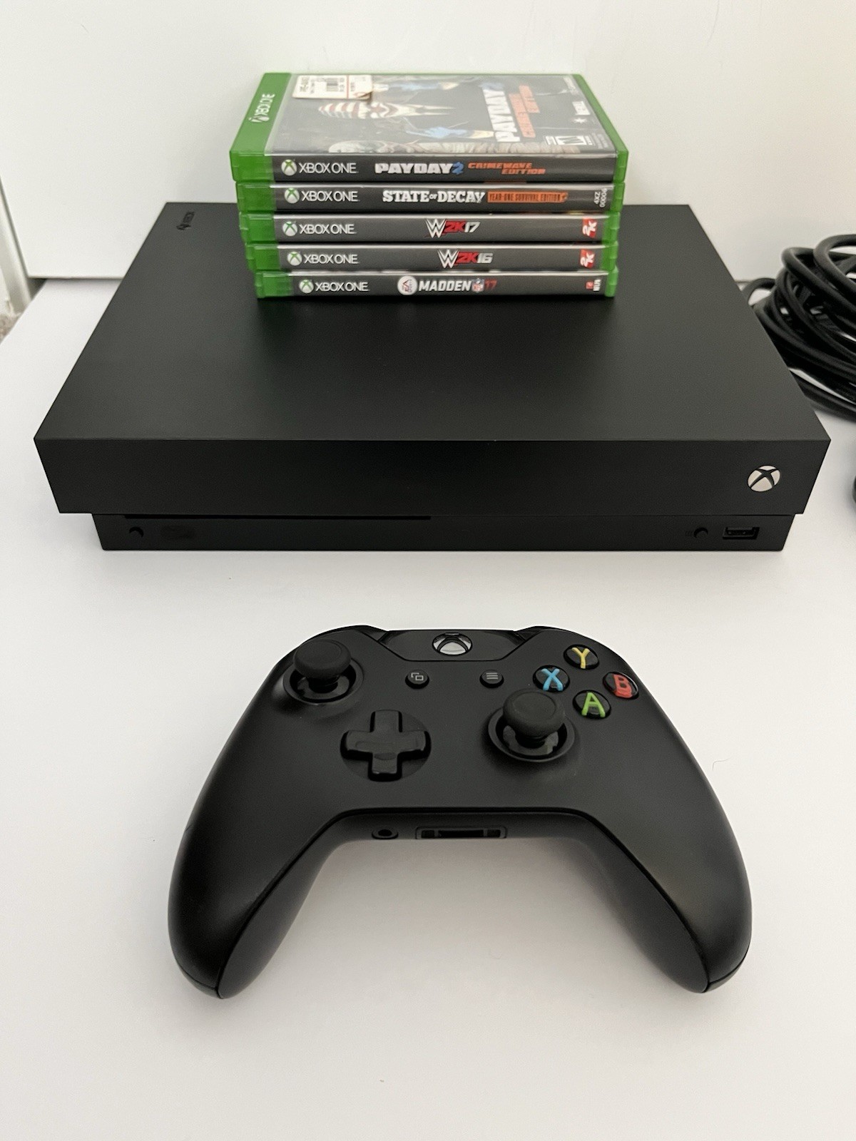 Microsoft Xbox One X 1TB Black – Includes Games, Controller, and Cables