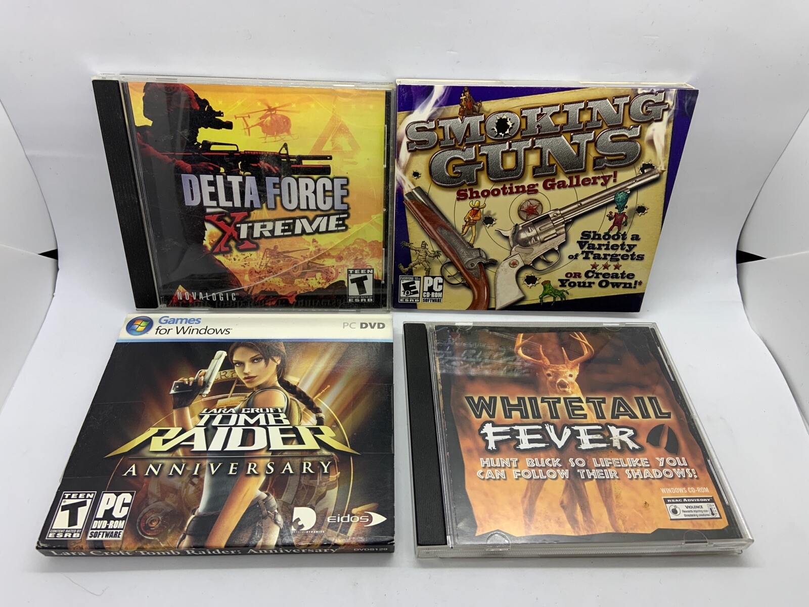 Lot Of 4 PC Shooting Games Whitetail Smoking Guns Delta Force Laura Croft Tomb