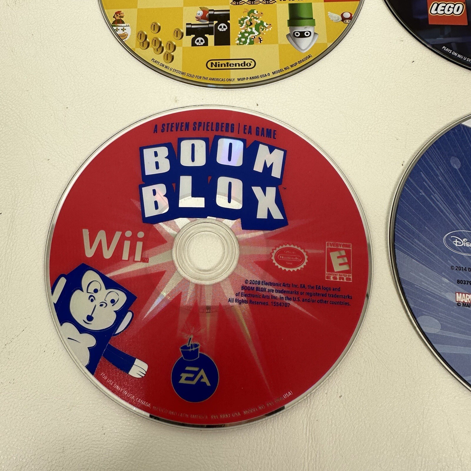 Wiiu Wii lot of 4 games Mario Maker Lego Batman Boom Blox Disney Infinity