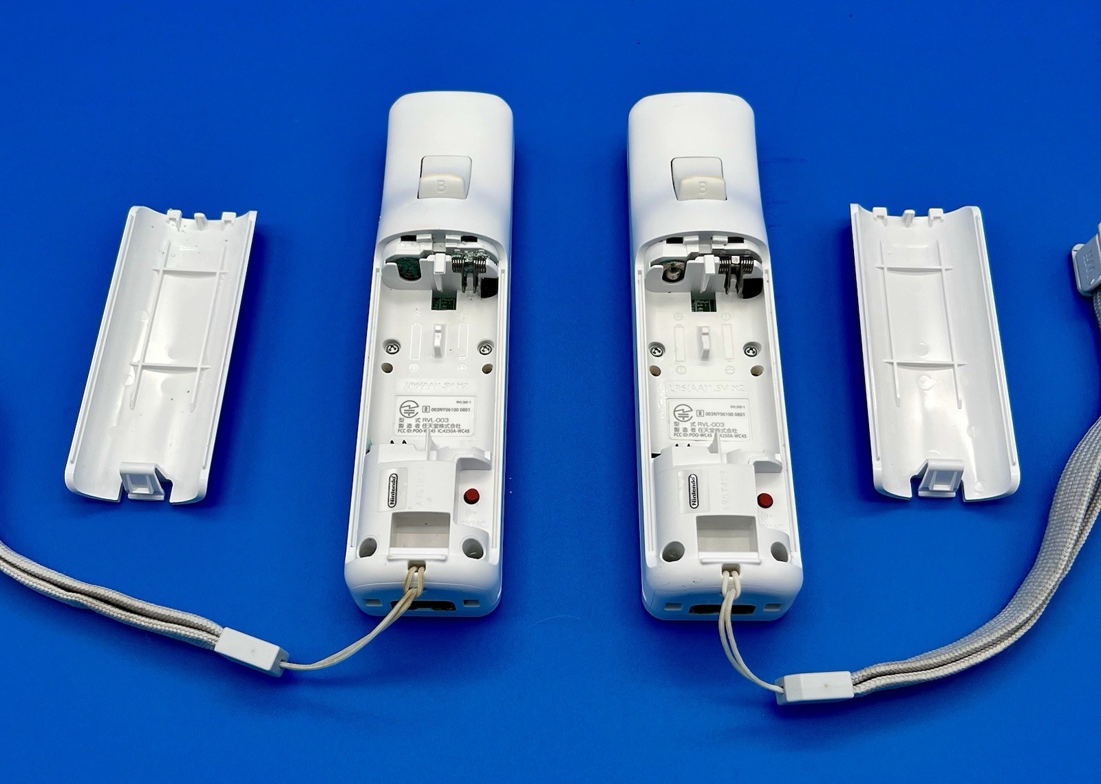 “Not Working”- Nintendo Wii White Remotes (2) with Straps & Sports Attachments