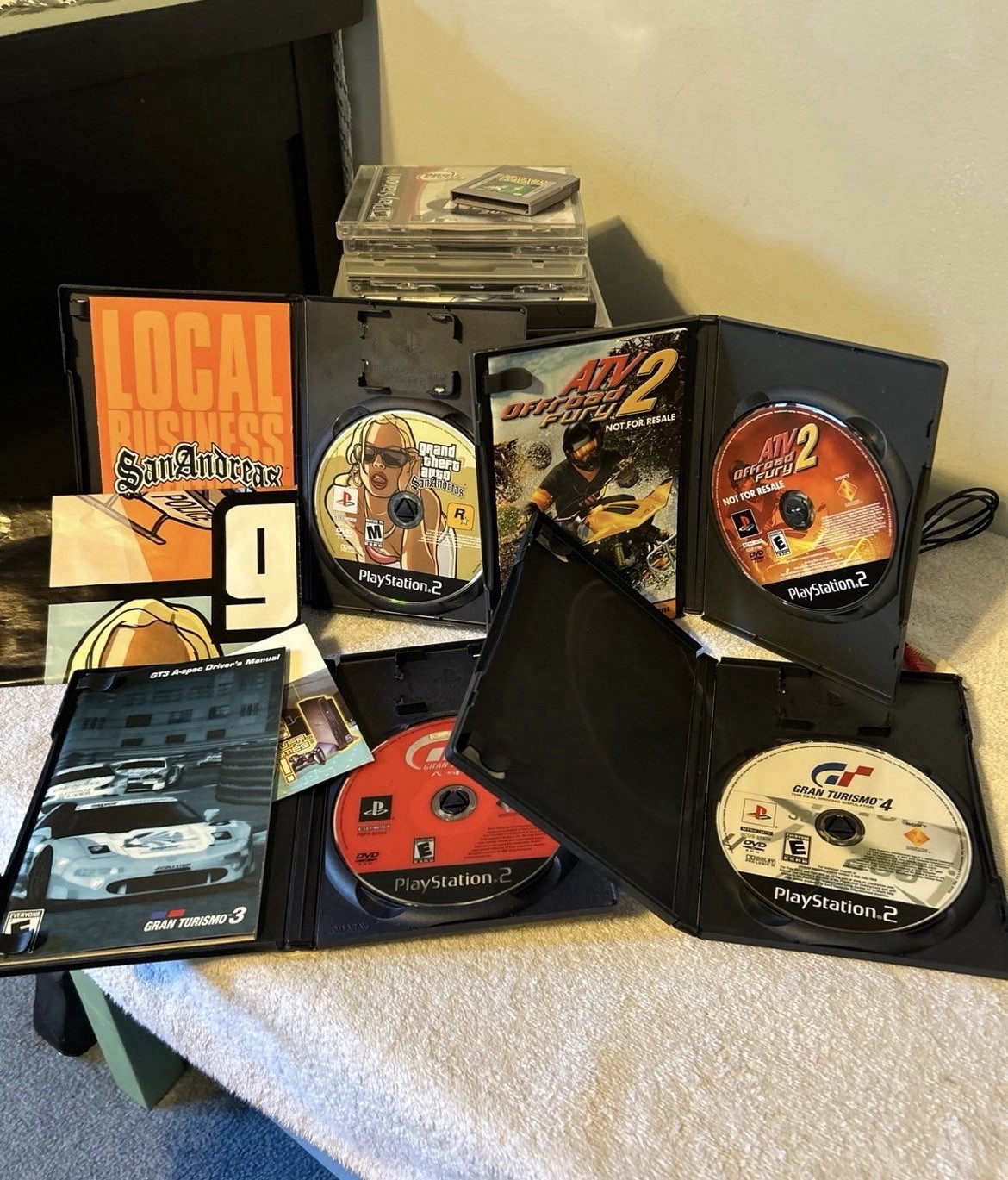 PlayStation 1, 2, & 3 Game lot. 19 total games & PS2 wired controller. Used