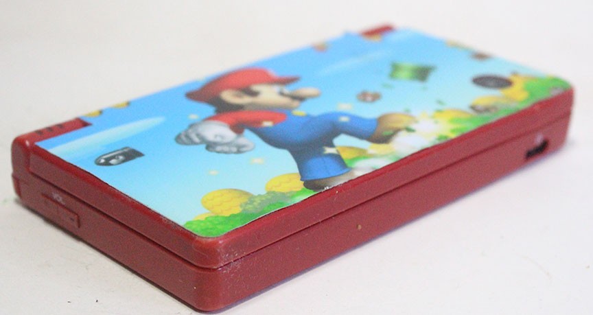 Nintendo DSi Red Handheld Game Console w/ Mario Skin Cover + Super Mario DS Game