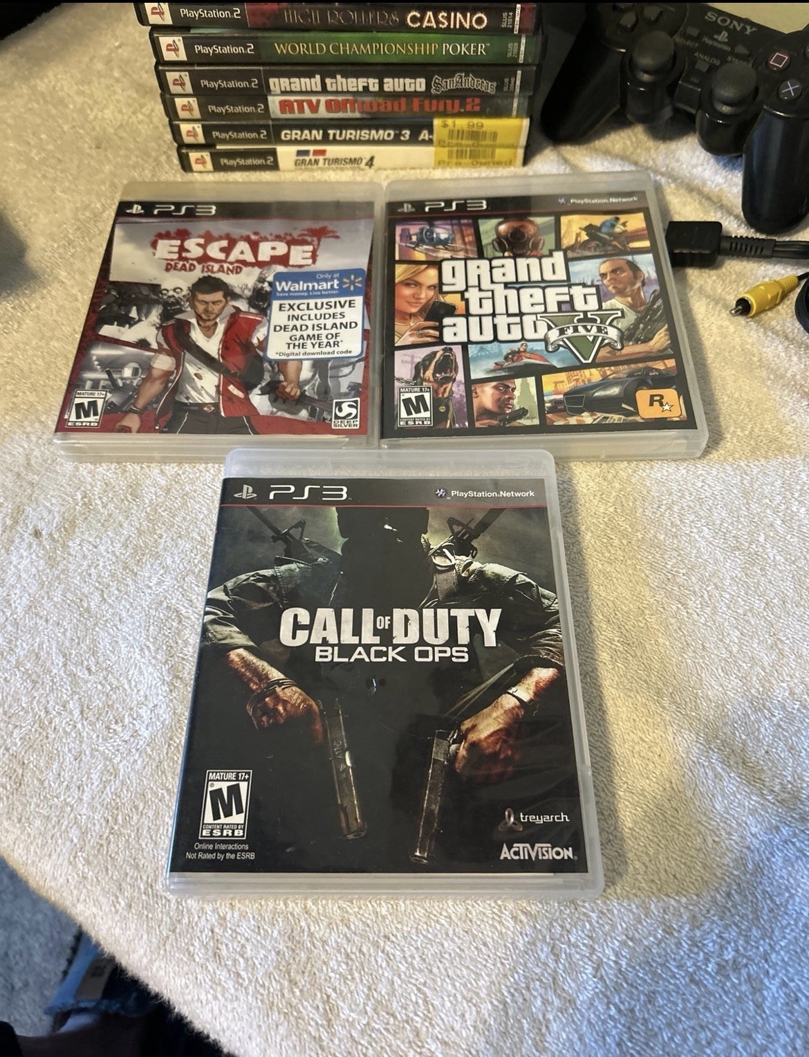 PlayStation 1, 2, & 3 Game lot. 19 total games & PS2 wired controller. Used